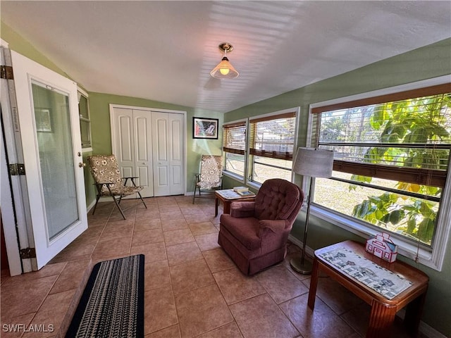 sunroom / solarium featuring lofted ceiling