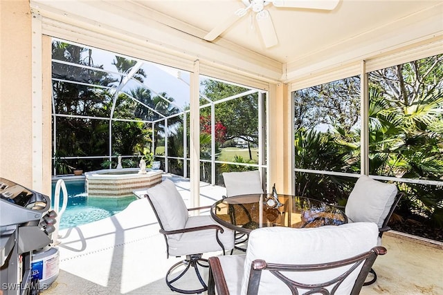 sunroom / solarium featuring a ceiling fan