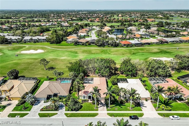 birds eye view of property featuring golf course view and a residential view