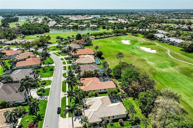 birds eye view of property featuring a water view, a residential view, and golf course view