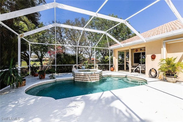 view of swimming pool with a pool with connected hot tub, glass enclosure, and a patio