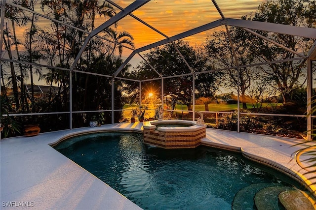 8880 Lely Island Cir, Naples, FL 34113 - view of pool featuring a pool with connected hot tub, a lanai, and a patio area