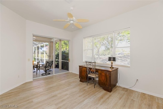 8880 Lely Island Cir, Naples, FL 34113 - office with baseboards, wood finished floors, and a ceiling fan