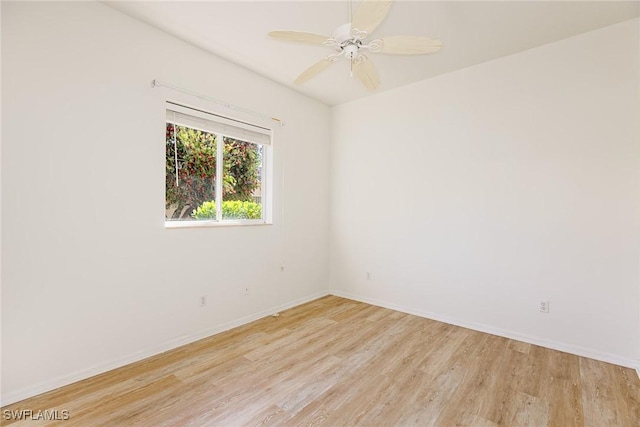 8880 Lely Island Cir, Naples, FL 34113 - empty room featuring light wood finished floors, baseboards, and a ceiling fan