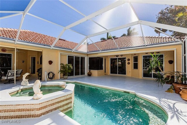 8880 Lely Island Cir, Naples, FL 34113 - view of swimming pool with a patio, a pool with connected hot tub, and a ceiling fan