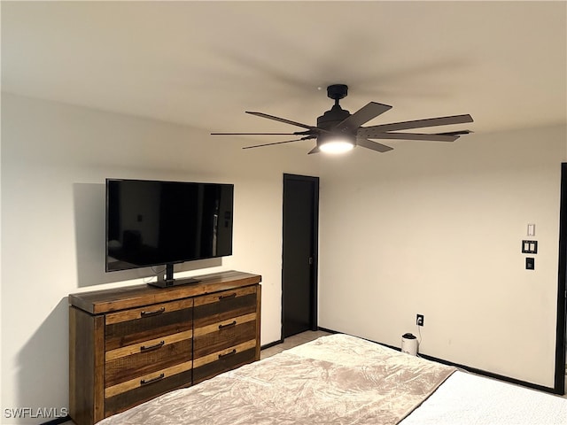 carpeted bedroom featuring a ceiling fan