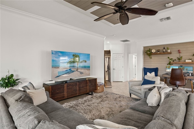 living area with ornamental molding, a ceiling fan, visible vents, and tile patterned floors