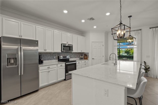 kitchen featuring stainless steel appliances, a sink, white cabinetry, decorative backsplash, and crown molding