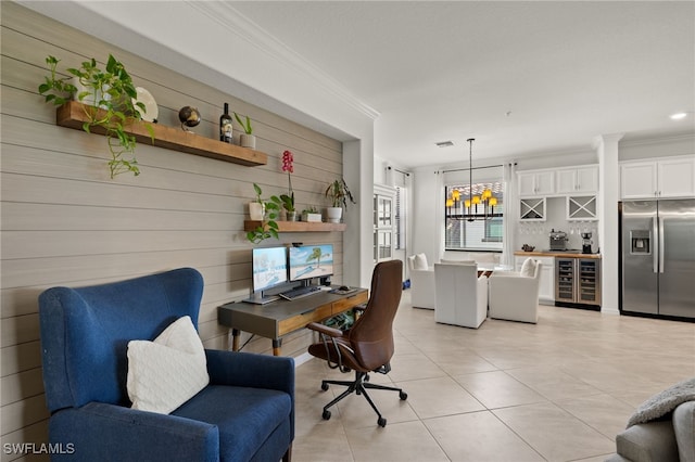 office with light tile patterned floors, visible vents, wine cooler, crown molding, and a notable chandelier