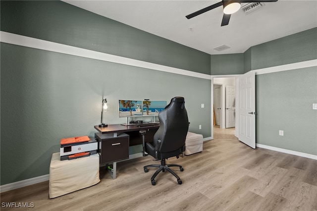 office featuring visible vents, ceiling fan, baseboards, and wood finished floors