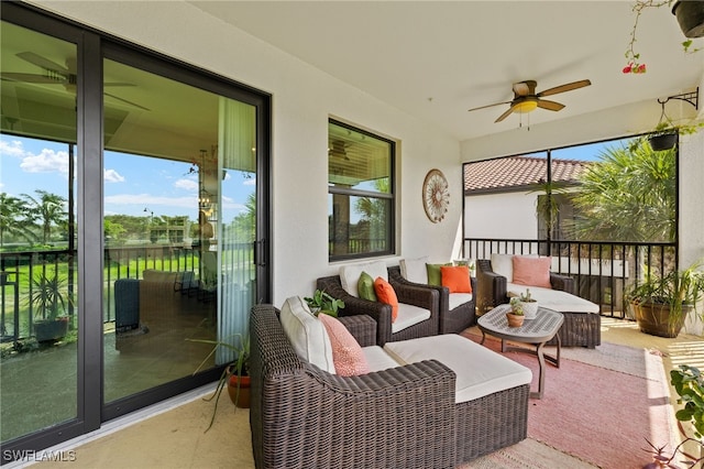 sunroom with a ceiling fan