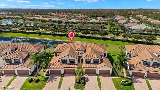 bird's eye view featuring a residential view and a water view