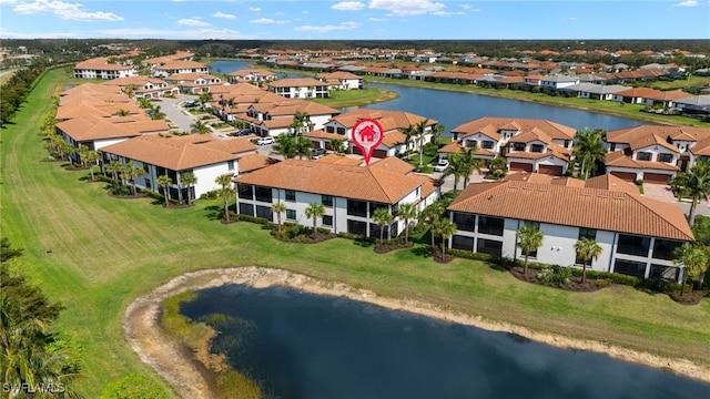 bird's eye view featuring a water view and a residential view