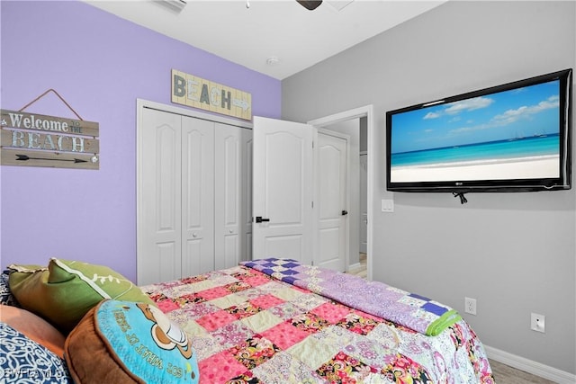 bedroom featuring a closet, a ceiling fan, and baseboards