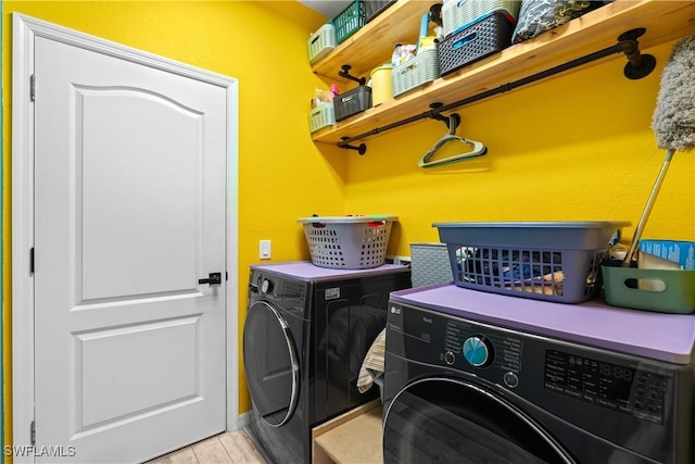 laundry area with laundry area and washer and clothes dryer
