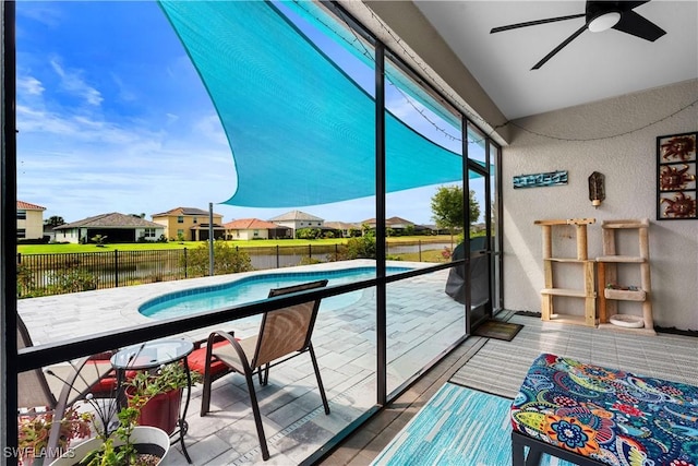 sunroom featuring a residential view