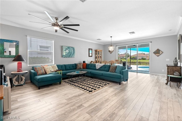 living room with crown molding, a ceiling fan, and light wood-type flooring
