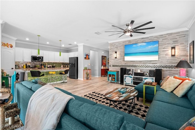living area with crown molding, recessed lighting, a ceiling fan, and light wood finished floors