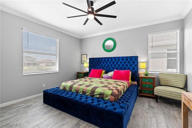 bedroom with baseboards, ornamental molding, a ceiling fan, and wood finished floors