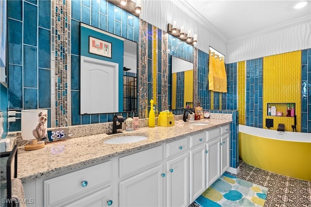 full bath featuring double vanity, a sink, a soaking tub, and ornamental molding