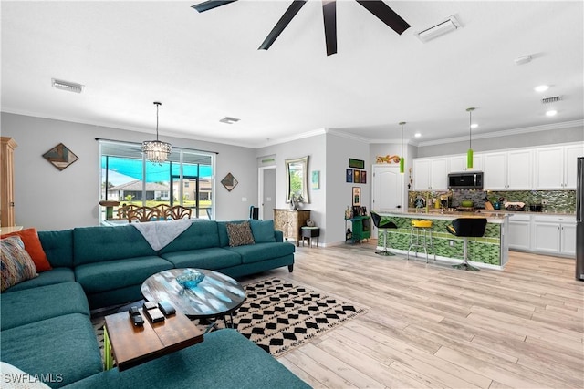 living area featuring visible vents, recessed lighting, light wood-style flooring, and ceiling fan