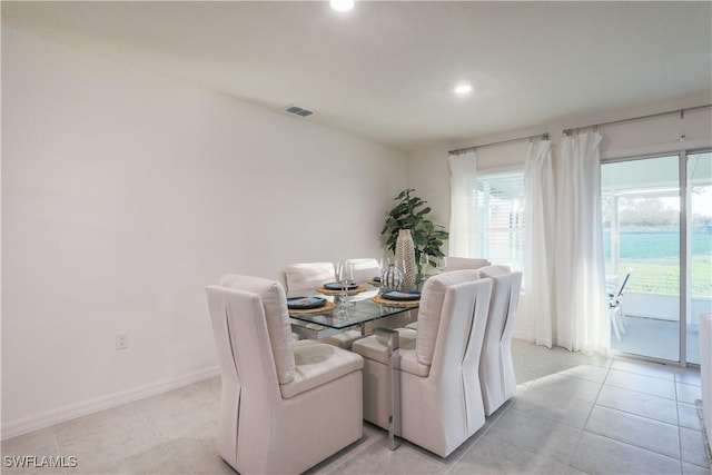 dining room featuring recessed lighting, baseboards, visible vents, and light tile patterned flooring