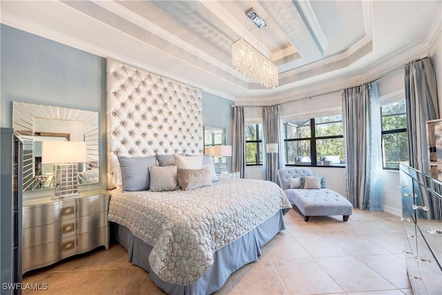 bedroom with ornamental molding, a tray ceiling, multiple windows, and tile patterned flooring