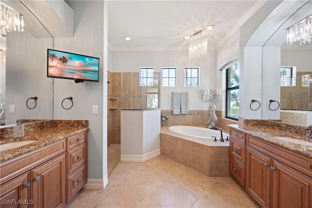 bathroom with a bath, ornamental molding, a walk in shower, and a sink