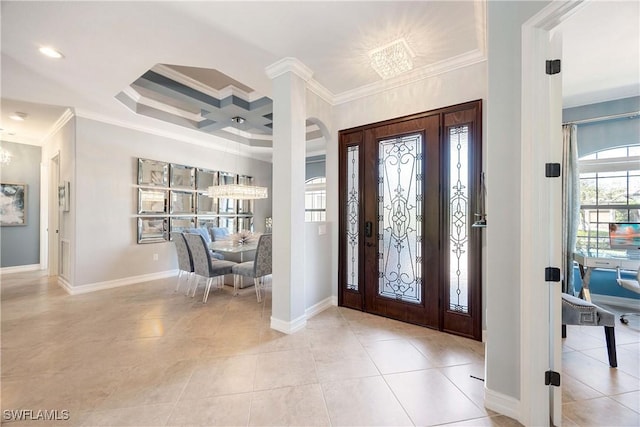 entrance foyer with light tile patterned floors, coffered ceiling, and crown molding