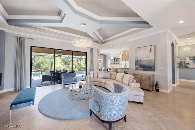 living area featuring light tile patterned floors, crown molding, baseboards, and a notable chandelier