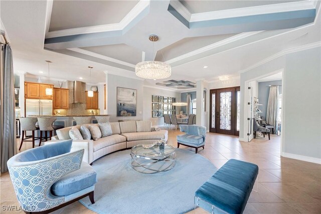 living area with light tile patterned floors, recessed lighting, crown molding, baseboards, and an inviting chandelier