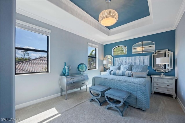 bedroom with ornamental molding, carpet flooring, a raised ceiling, and baseboards