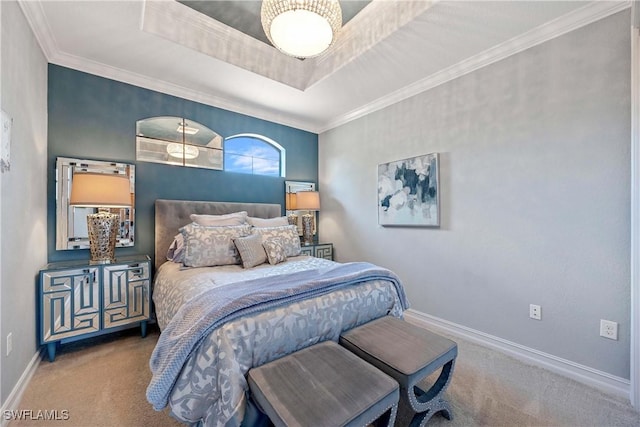 bedroom with carpet, a tray ceiling, crown molding, and baseboards