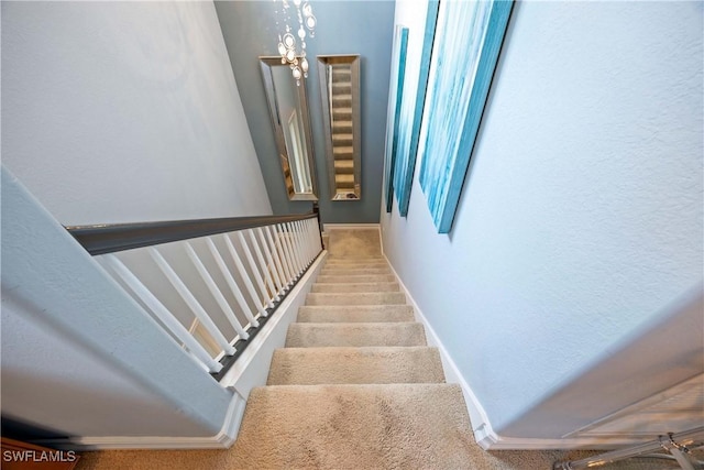 stairway featuring baseboards