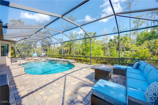 view of pool with a lanai, a patio area, an outdoor hangout area, and an in ground hot tub