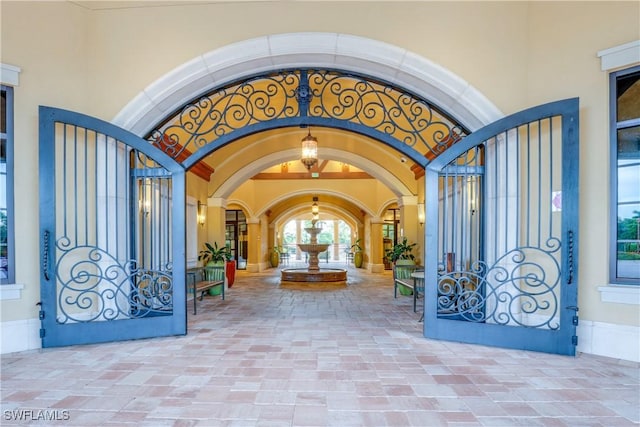 exterior space featuring arched walkways