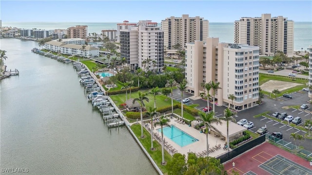 bird's eye view featuring a water view and a city view