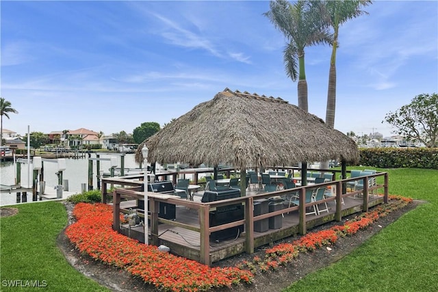 view of dock featuring a gazebo and a yard