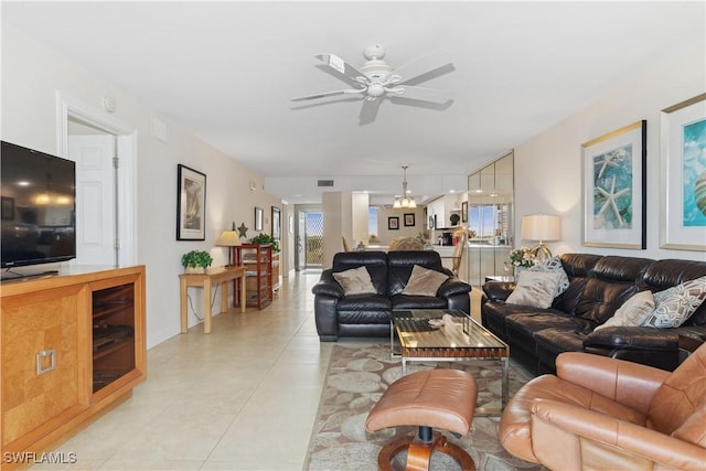 living room featuring light tile patterned floors, ceiling fan, and visible vents