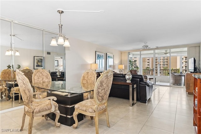 dining area featuring light tile patterned flooring and a ceiling fan