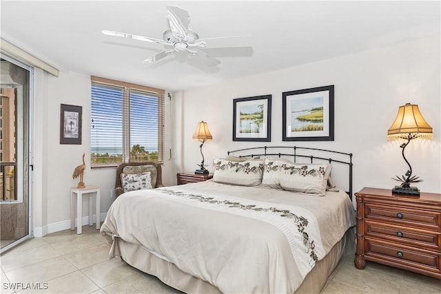 bedroom featuring light tile patterned floors, ceiling fan, and baseboards