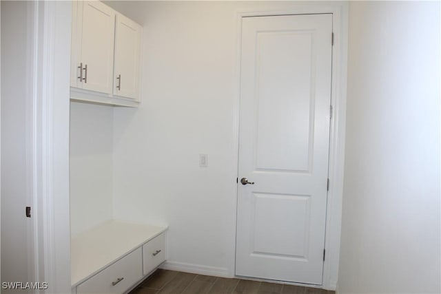 mudroom with baseboards and wood finished floors