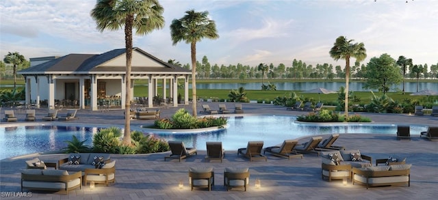 community pool featuring a water view and a patio