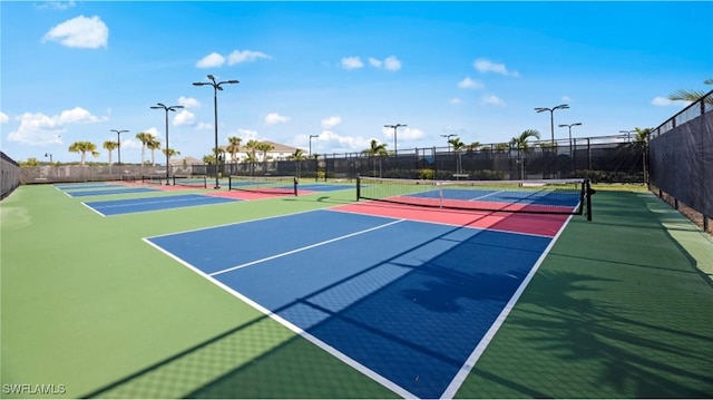 view of sport court featuring community basketball court and fence