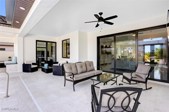 view of patio / terrace with ceiling fan and an outdoor hangout area