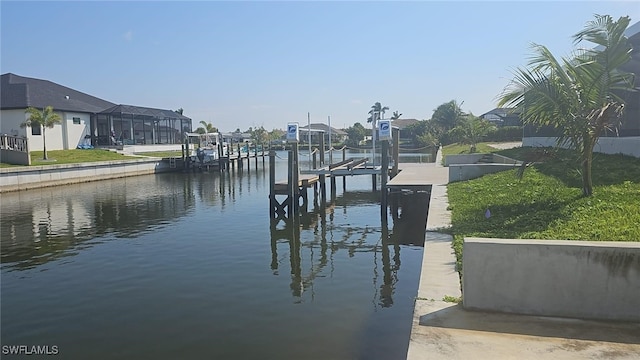 dock area with boat lift and a water view