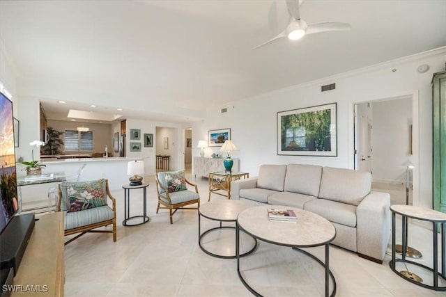 living room featuring light tile patterned floors, ceiling fan, crown molding, and recessed lighting