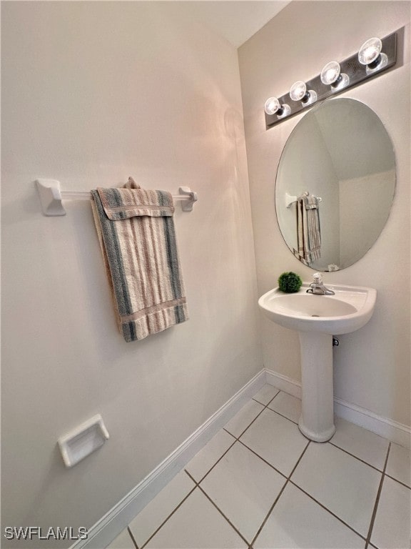 bathroom featuring tile patterned flooring and baseboards