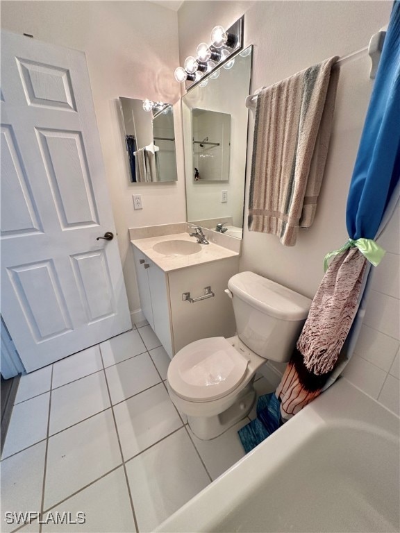 full bathroom with vanity, toilet, and tile patterned floors