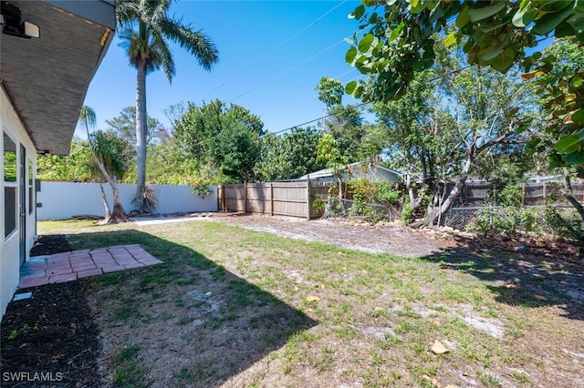 view of yard with a fenced backyard